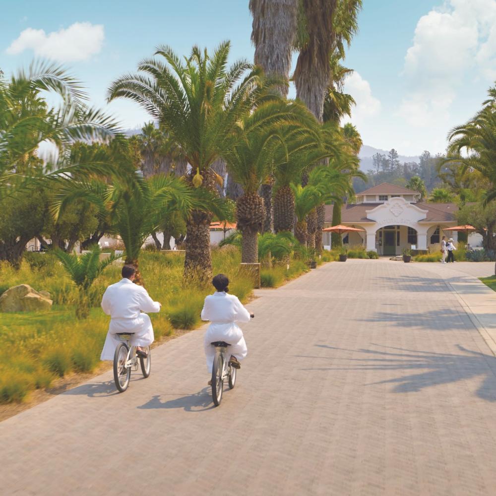 Couple riding biking to the Indian Springs spa