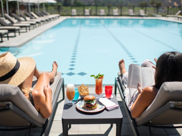 women lounging at Four Seasons pool