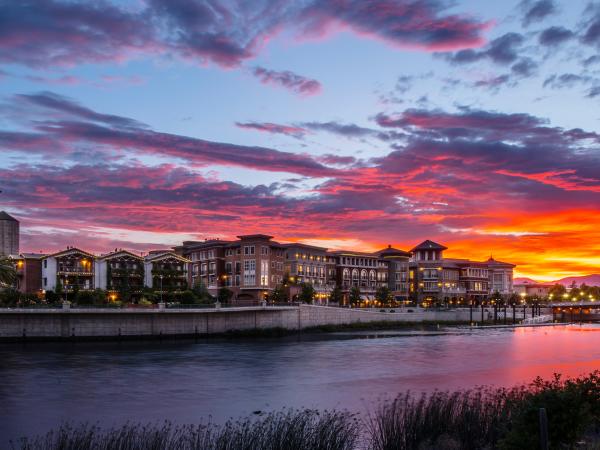 A bold sunset paints the sky over the Napa River