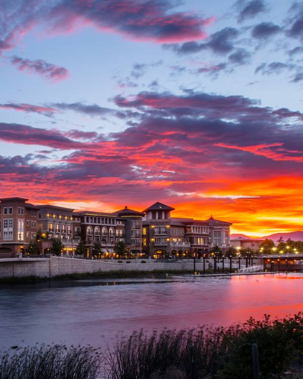 A bold sunset paints the sky over the Napa River