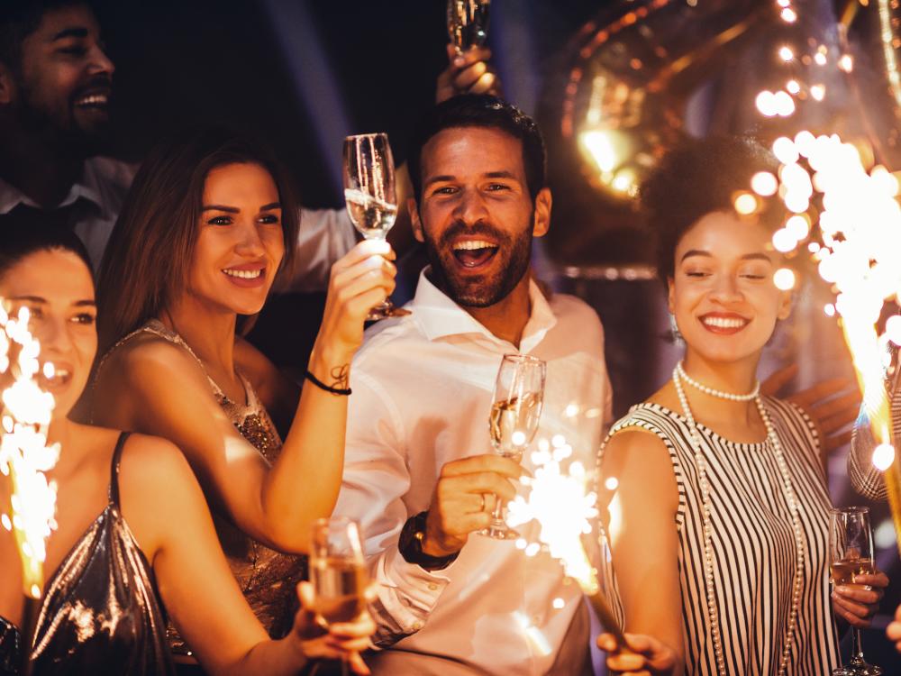 People celebrating with wine and sparklers