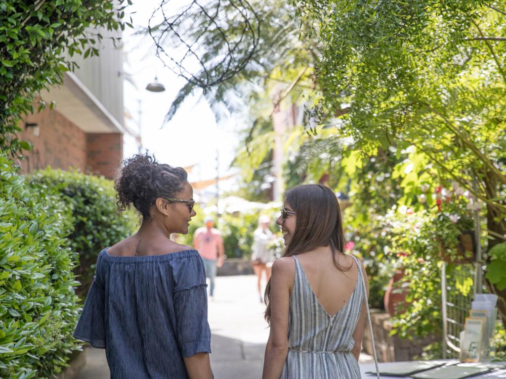 Women walk and chat on a sunny day in Napa Valley